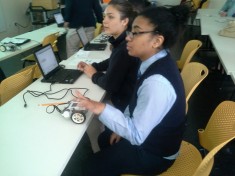 Scholars from Excel Academy Charter Schools and Roxbury Preparatory Charter School program a robot at the MIT Museum.