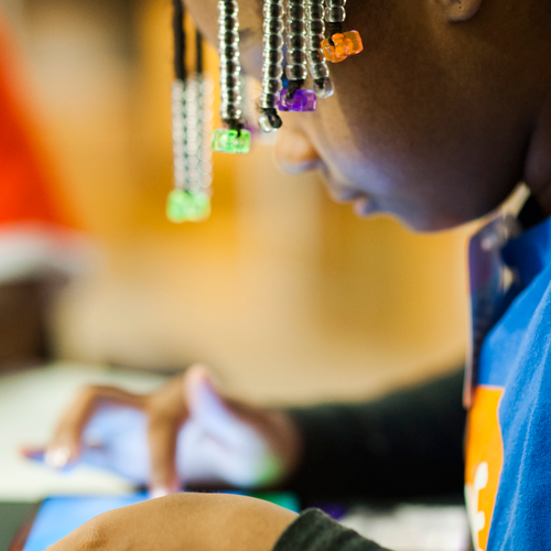 A student from GLIDE's youth art summer program playtests an app at co.lab. (Photo:  Erin Beach)